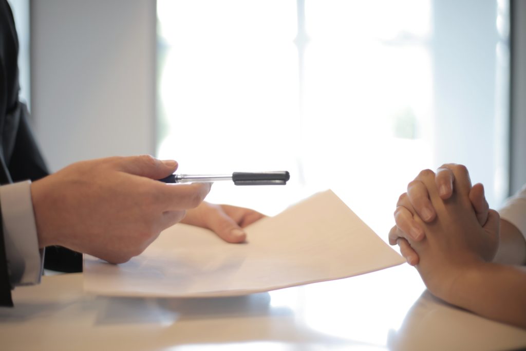 hands-holding-pen-paper